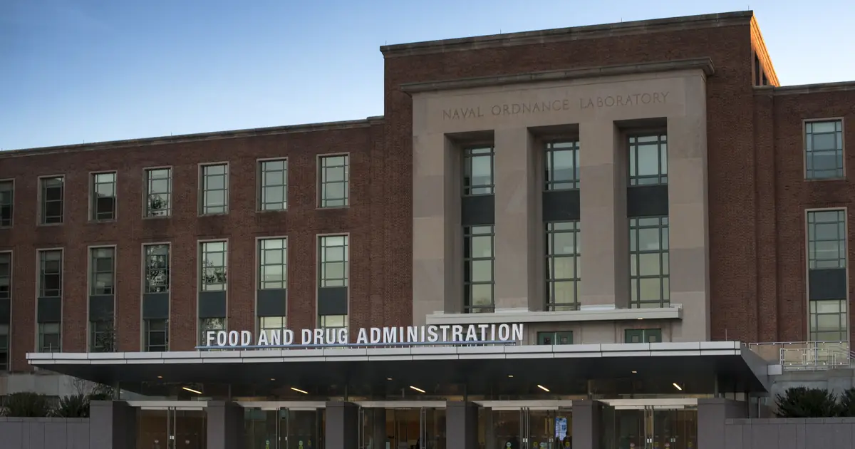 Front of FDA Building 1 at the agency's White Oak campus in Maryland: a brick building with the words Food and Drug Administration above the entrance.
