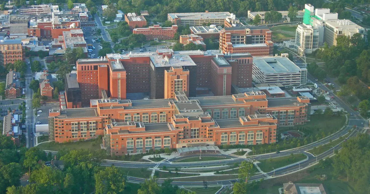 Aerial view of the NIH Clinical Center and surrounding campus buildings in Bethesda, Maryland.